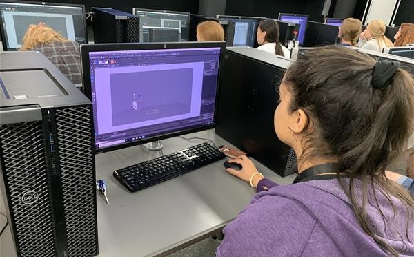 Group photo of campers working on a project in City Transformers Studio