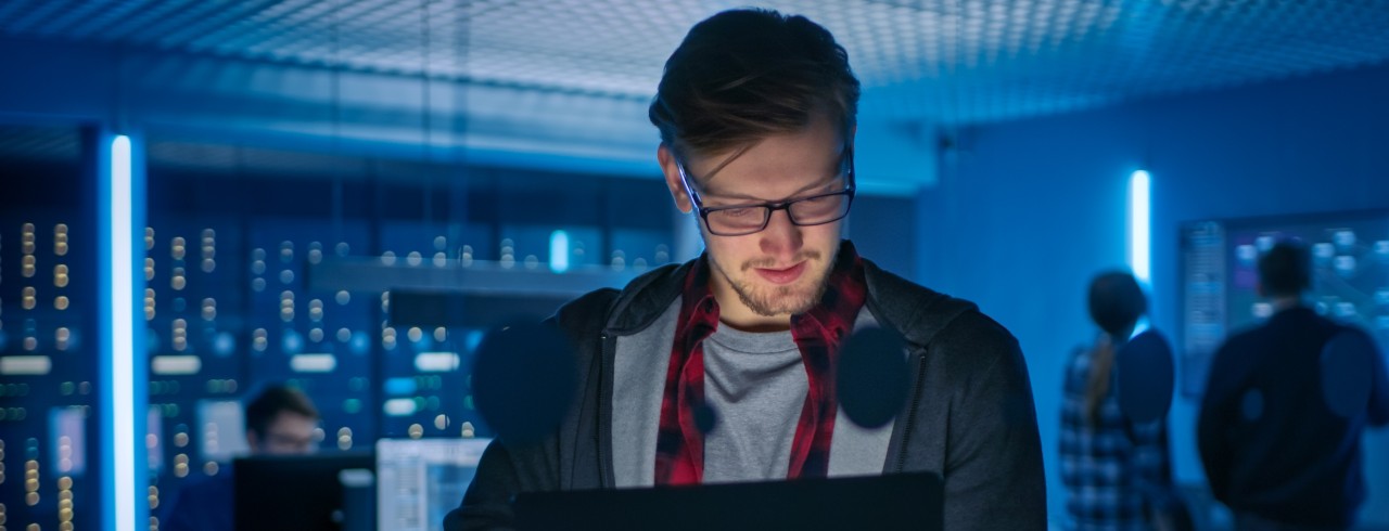 Man working in a high-tech lab. Photo/Gorodenkoff via Adobe Stock