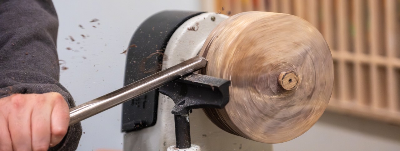 Image of student working on machinery in the build lab.